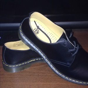 Dr Martens men's size 13 with yellow stitching.